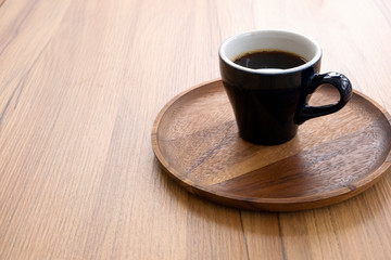 Hot coffee on a wooden table