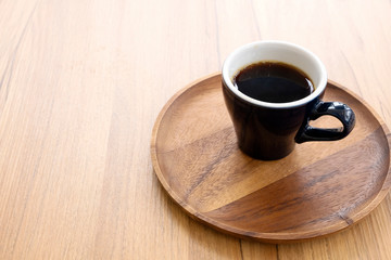 Hot coffee on a wooden table