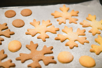 Snowflake Cookies. Snowflake shaped Gingerbread cookies stacked and tied with a gold bow.