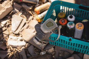Protective mass and spray paints inside the basket at alley