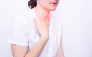 Naklejka premium Young caucasian girl on a white background whose pain and inflammation in the throat concept of pharyngitis and laryngti throat diseases, infectious diseases