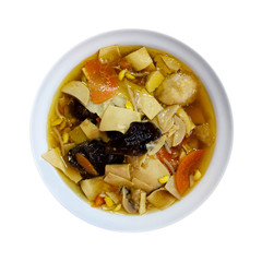 Chinese cousine. Chinese soup in a plate isolated on white background. Top view.