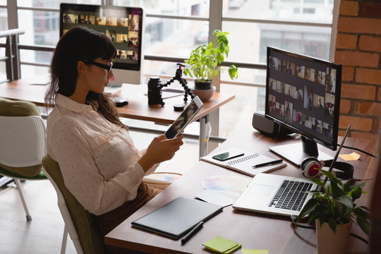 Businesswoman using digital tablet in office 