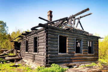 Ruins of a burned down old wooden hut