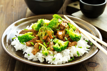 Beef with broccoli and rice. Asian cuisine.