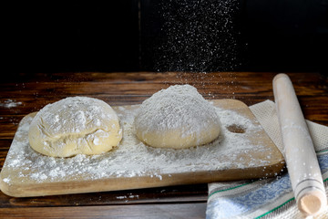 Pizza dough sprinkled with a bunch
