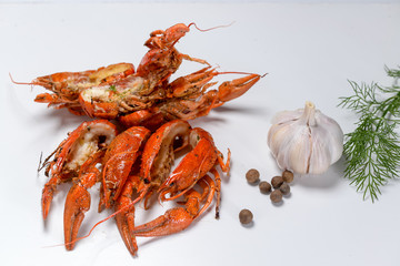 boiled crayfish with spices on a white background