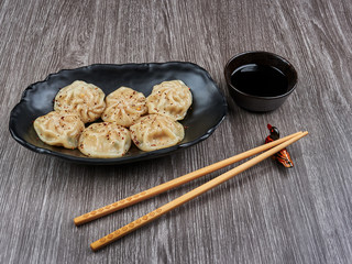 Korean steamed dumplings snack with soy sauce