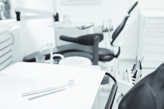 dentist concept, tools on  dentist chair in dental clinic interior