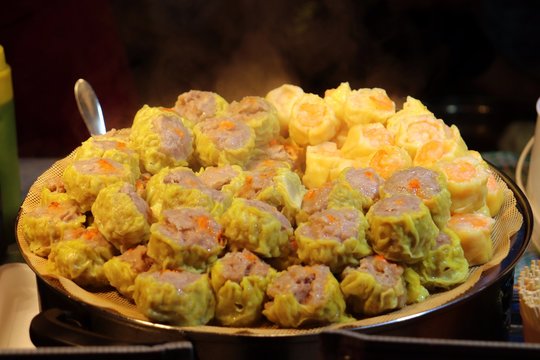 Chinese food, Sui mai stacked on a large plate for sale in night market