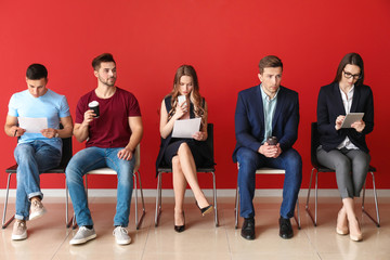 Young people waiting for job interview indoors