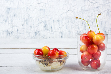 Cherry. Cherries in bowl. Fresh yellow cherry. Cherry on white wooden background. healthy food concept. Berries