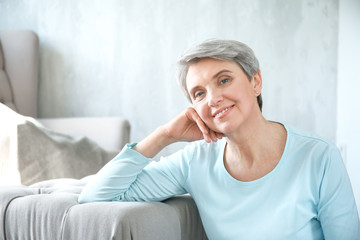 Portrait of beautiful mature woman at home