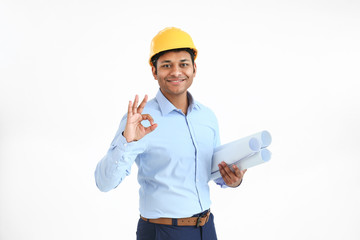 Handsome architect showing OK on white background