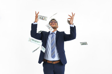 Happy businessman and falling dollar banknotes on white background