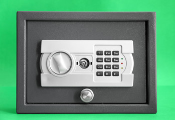 Modern safe on color background