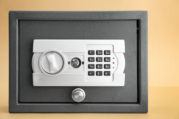 Modern safe on color background