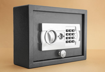 Modern safe on color background