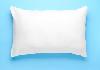 Soft pillow on color background