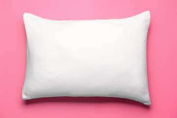 Fototapeta na wymiar Soft pillow on color background