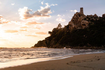 Fototapeta na wymiar Sardinia seashore and cliffs at sunset