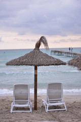 two chairs and umbrella on the beach
