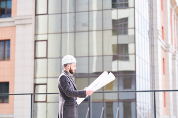 Engineer with blueprint