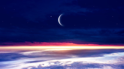 Obraz na płótnie Canvas Crescent moon with beautiful sunset background . Generous Ramadan . Light from sky . Religion background . 