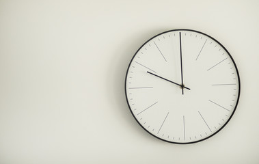 Classic black and white round wall clock .