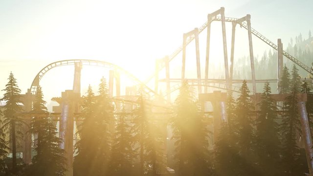 old roller coaster at sunset in forest
