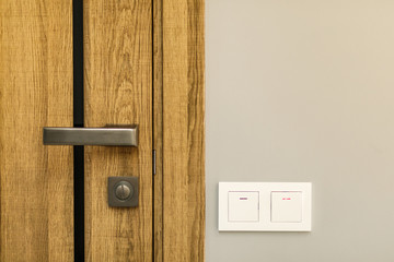 modern style door handle on natural wooden door