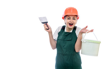 Woman in helmet with paint bucket isolated on white