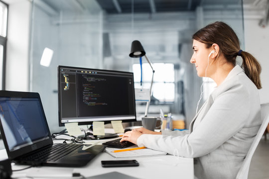 business, technology and people concept - businesswoman with computer working at office
