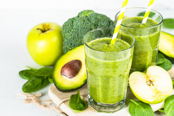 Green smoothie from fruit and vegetable on white.