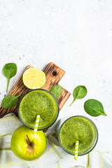 Green smoothie from fruit and vegetable on white.