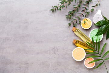 Beauty and aromatherapy concept with spa set on pastel rustic wooden background.