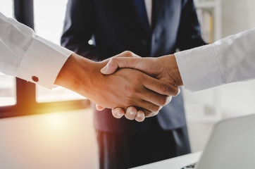 Deal. group of business people handshake after finishing up business meeting in meeting room at...
