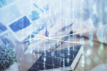 Multi exposure of woman hands on background with technology coding hologram. Data concept.