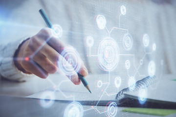 Double exposure of woman's hands on background with technology and digital coding icons. Data development concept. Close up.