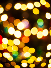 Obraz premium Christmas Eve, New Year decoration lights bokeh blurred background.