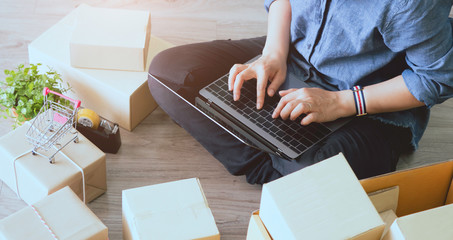 Shipping online ,young woman start up small business owner in Labtop at workplace.small business entrepreneur SME or freelance