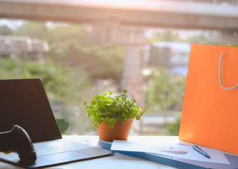 SME or Small and medium-sized enterprises Computer flare sun. Barcode scanner statistics.graph paper and small tree on desk