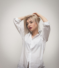 Fototapeta premium Horizontal portrait of a beautiful girl on a chair.