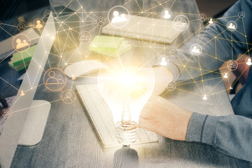 Media network theme hologram with man working on computer on background. Concept of internet...
