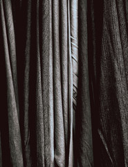 White and black color piece of a cloth Jeans as a background texture pattern.