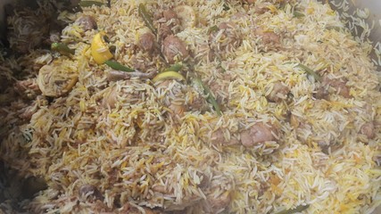 A close up  view of cooked rice chicken biryani made with traditional recipe