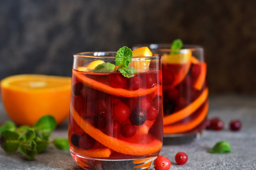 Hot cranberry tea with orange, mint and spices.
