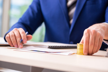 Young male sales analyst in growth concept 