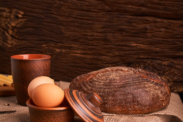 Assorted dairy products milk, cheese, eggs. rustic still life on table