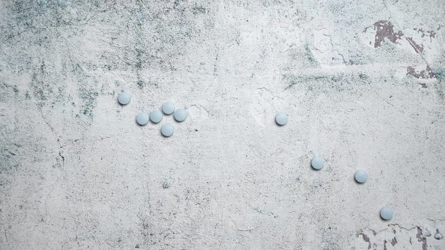 Blue Pills on concrete background